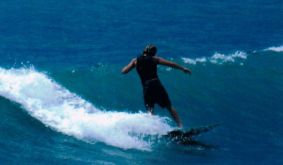 Former Marine Jon Hammar, who served combat tours in Afghanistan and Iraq, was arrested for illegally possessing an antique firearm even though he declared the gun to Mexican Customs agents. He is shown during surfing in Costa Rica in 2007. He could face up to 15 years in prison if convicted. (Photo courtesy Olivia Hammar)