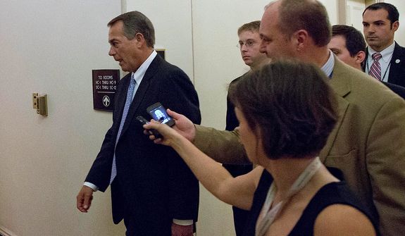 Speaker John Boehner of Ohio, center, departs, with reporters nearby after a House Republicans meeting on Capitol Hill, Thursday, Dec. 20, 2012 in Washington. Confronted with a revolt among the rank and file, House Republicans abruptly put off a vote Thursday night on legislation allowing tax rates to rise for households earning $1 million and up.(AP Photo/Alex Brandon)