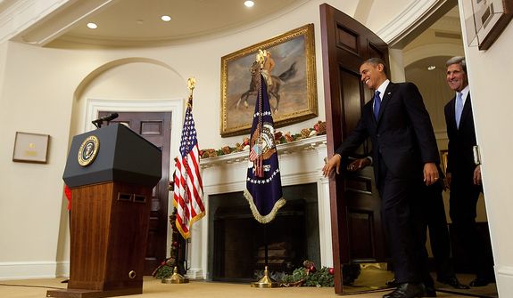 President Barack Obama enters the Roosevelt Room with Sen. John Kerry, D-Mass., his choice to be the next Secretary of State,  before he makes his announcement at the White House in Washington, Friday, Dec. 21, 2012. (AP Photo/Carolyn Kaster)