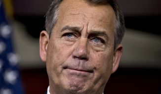House Speaker John A. Boehner, Ohio Republican, speaks to reporters about the &quot;fiscal cliff&quot; negotiations at the Capitol in Washington on Friday, Dec. 21, 2012. (AP Photo/J. Scott Applewhite)