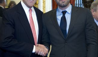 ** FILE ** Sen. John F. Kerry, Massachusetts Democrat, shakes hands with actor Ben Affleck during a meeting with lawmakers on Capitol Hill in Washington on Wednesday, Dec. 19, 2012, to discuss the crisis in the Democratic Republic of Congo. (AP Photo/Jose Luis Magana)