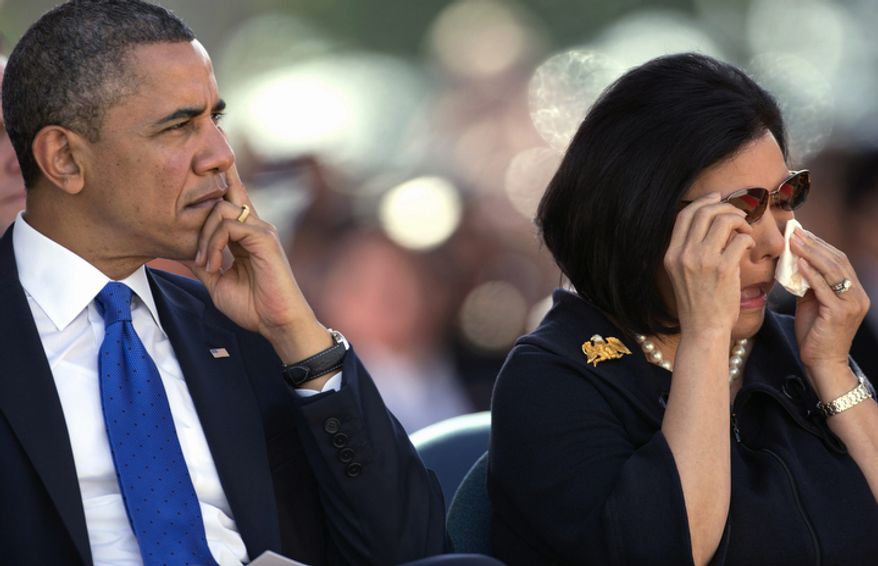 During a memorial service for the late Sen. Daniel Inouye, D-Hawaii, President Barack Obama, left, sits next to Irene Hirano Inouye, the widow of the late Sen. Daniel Inouye, at the National Memorial Cemetery of the Pacific, Sunday, Dec. 23, 2012, in Honolulu. Inouye was the first Japanese-American elected to both houses of Congress and the second-longest serving senator in U.S. history. (AP Photo/Carolyn Kaster)