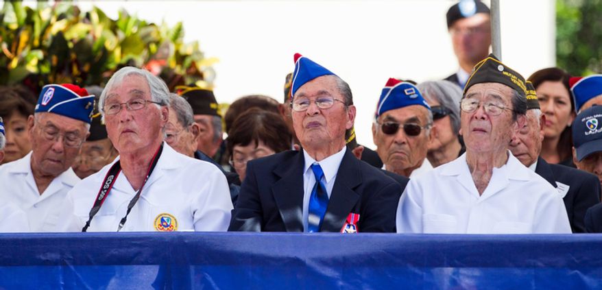 Veterans of the 442nd Regimental Combat Team Battalion attend the memorial service for U.S. Sen. Daniel Inouye, D-Hawaii at the National Memorial Cemetery of the Pacific, Sunday, Dec. 23, 2012 in Honolulu. Inouye was part of the 442nd which fought in Europe during World War II. (AP Photo/Marco Garcia)