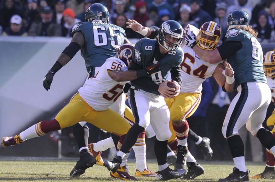 Washington Redskins inside linebacker Perry Riley (56) sacks Philadelphia Eagles quarterback Nick Foles (9) for an 8-yard loss in the first quarter at Lincoln Financial Field, Philadelphia, Pa., Dec. 23, 2012. (Preston Keres/Special to The Washington Times)