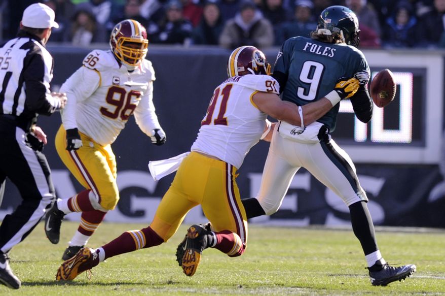 ** FILE ** Washington Redskins outside linebacker Ryan Kerrigan (91) sacks Philadelphia Eagles quarterback Nick Foles (9) and forces a fumble for a turnover in the second quarter at Lincoln Financial Field, Philadelphia, Pa., Dec. 23, 2012. (Preston Keres/Special to The Washington Times)