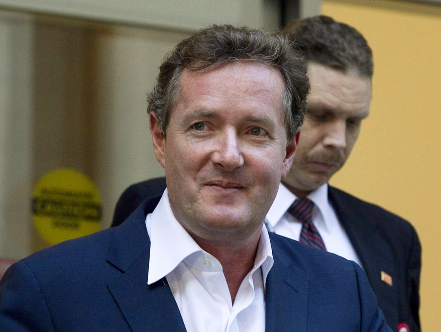 ** FILE ** Piers Morgan, host of CNN&#39;s &quot;Piers Morgan Tonight,&quot; leaves the CNN building in Los Angeles on Tuesday, Dec. 20, 2011. (AP Photo/Jae C. Hong)