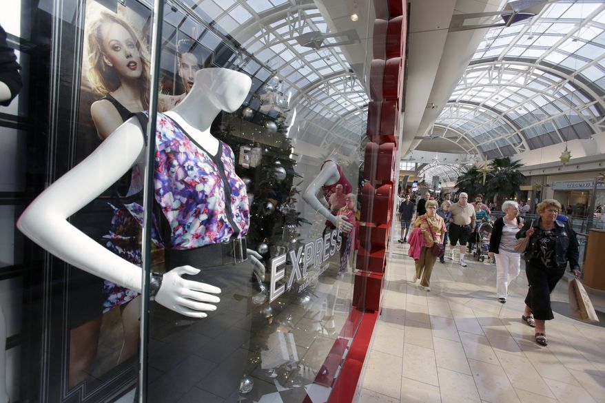 Shoppers walk through a mall in Orlando, Fla., on Thursday, Dec. 20, 2012. (AP Photo/John Raoux)