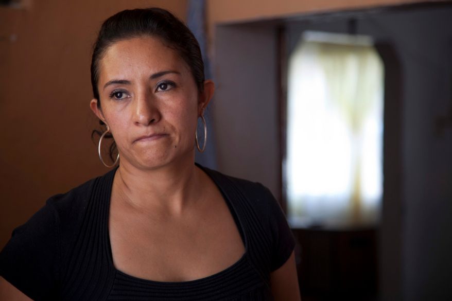 Sandra Payes Chacon, wife of Rony Molina, pauses while talking about her children to The Associated Press at a friend's home in Atlixco, Mexico, on Thursday, June 7, 2012. Mrs. Chacon, who lived in the U.S. illegally, was deported to Guatemala a year and a half ago. She left behind her husband and her three children, all of them U.S. citizens. (AP Photo/Dario Lopez-Mills)