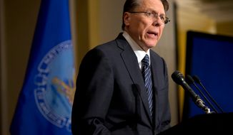 ** FILE ** Wayne LaPierre, executive vice president and CEO of the National Rifle Association, speaks during a news conference in Washington on Friday, Dec. 21, 2012, in response to the Newtown, Conn., school shooting the week before. The NRA, the nation&#39;s largest gun-rights lobby, is calling for armed police officers to be posted in every American school to stop the next killer &quot;waiting in the wings.&quot; (Associated Press)