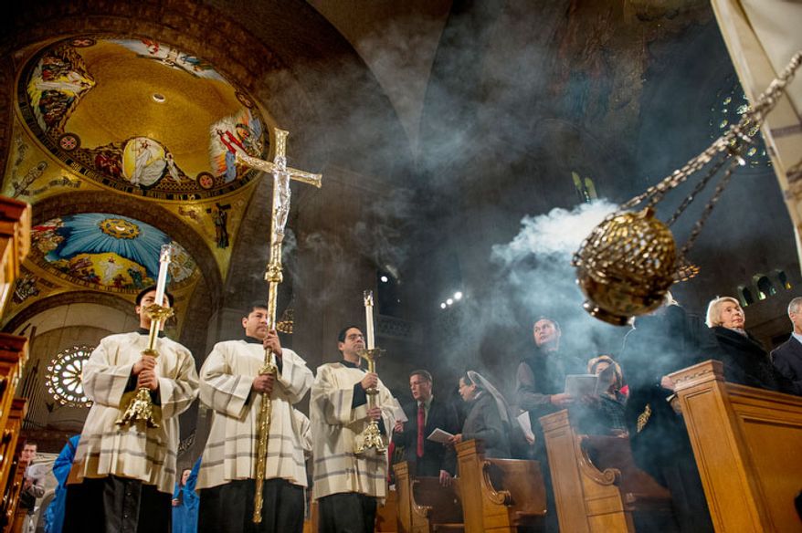 A processional makes its way to the main altar as the Archbishop of Washington Cardinal Donald Wuerl leads a congregation of 4,000 in Solemn Mass of Christmas Day at the Basilica of the National Shrine of the Immaculate Conception, Washington, D.C., Tuesday, December 25, 2012. (Andrew Harnik/The Washington Times)