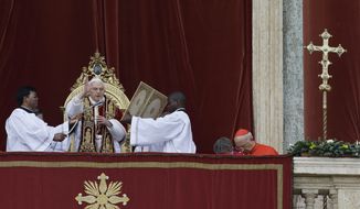 Pope Benedict XVI delivers his &quot;Urbi et Orbi&quot; (&#39;To the City and to the World&quot;) speech from the central loggia of St. Peter&#39;s Basilica at the Vatican on Tuesday, Dec. 25, 2012. (AP Photo/Gregorio Borgia)
