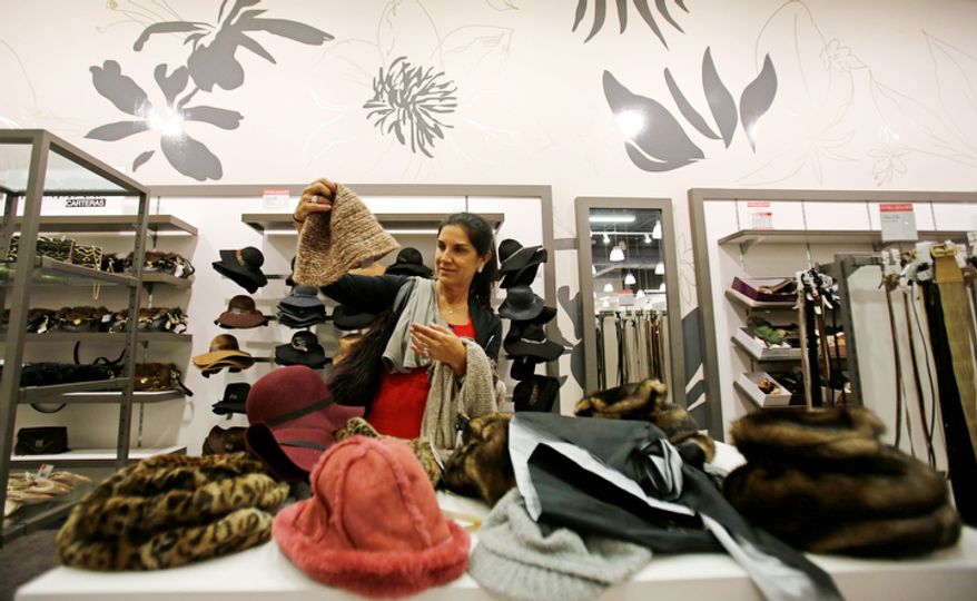 Kiki Infante checks out the merchandise for her Christmas presents in Miami, Thursday, Dec. 20, 2012. (AP Photo/Alan Diaz)