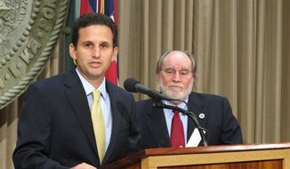 Hawaii Lt. Gov. Brian Schatz speaks the state Capitol in Honolulu on Wednesday, Dec. 26. 2012 after Gov. Neil Abercrombie, right, announced he was appointing Schatz to fill the seat vacated by the late U.S. Sen. Daniel Inouye. (Associated Press)