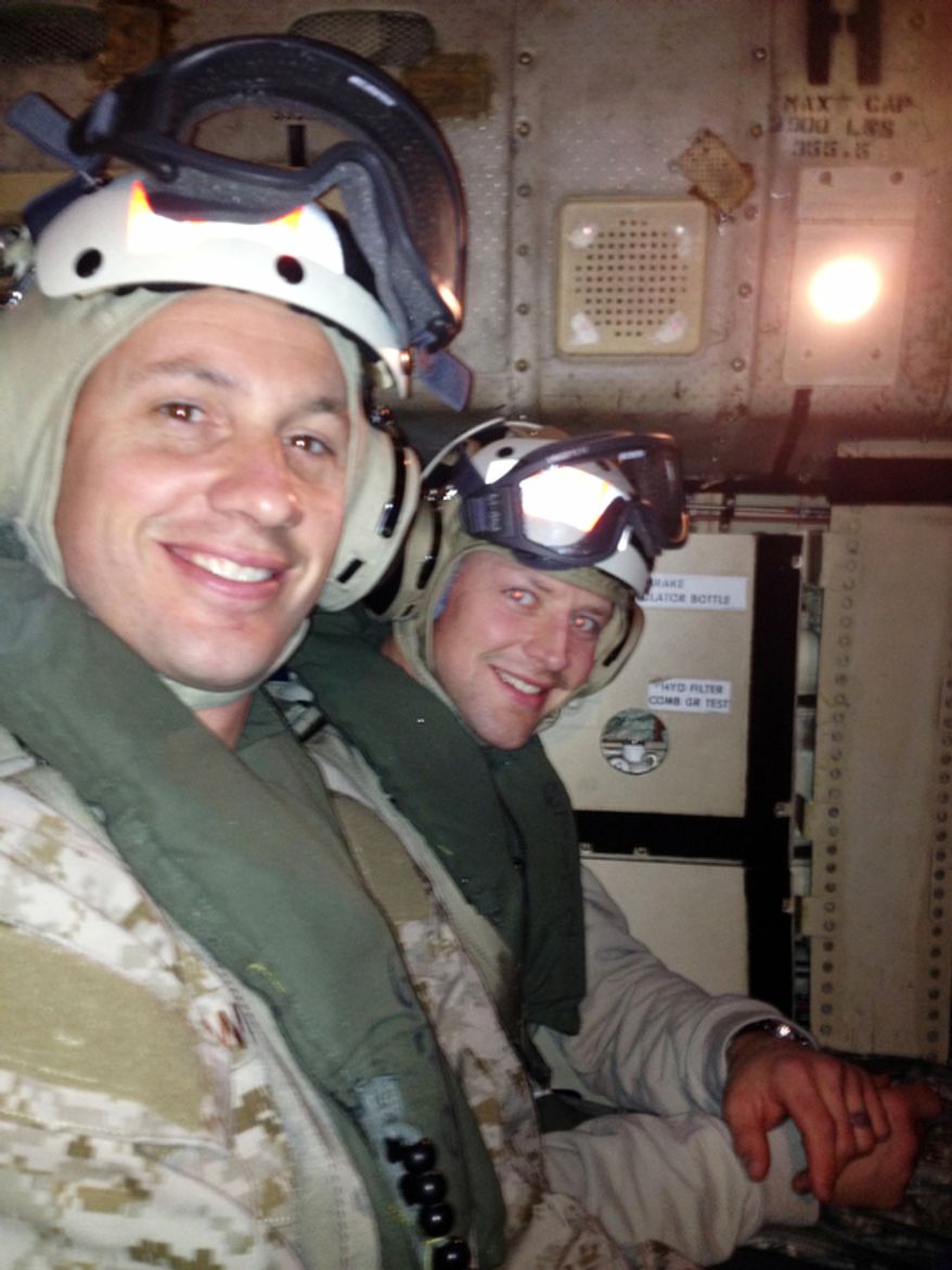 On a COD (Carrier Onboard Delivery) set to land on the USS John C. Stennis Aircraft Carrier is Washington Capitals player Matt Hendricks, right, and U.S. Navy Seal Major Wisecup, at left in the foreground. (Courtesy of Matt Hendricks)