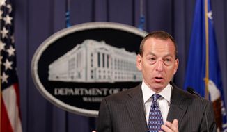 **FILE** Assistant Attorney General Lanny Breuer speaks Oct. 4, 2010, during a news conference at the Justice Department in Washington. (Associated Press)