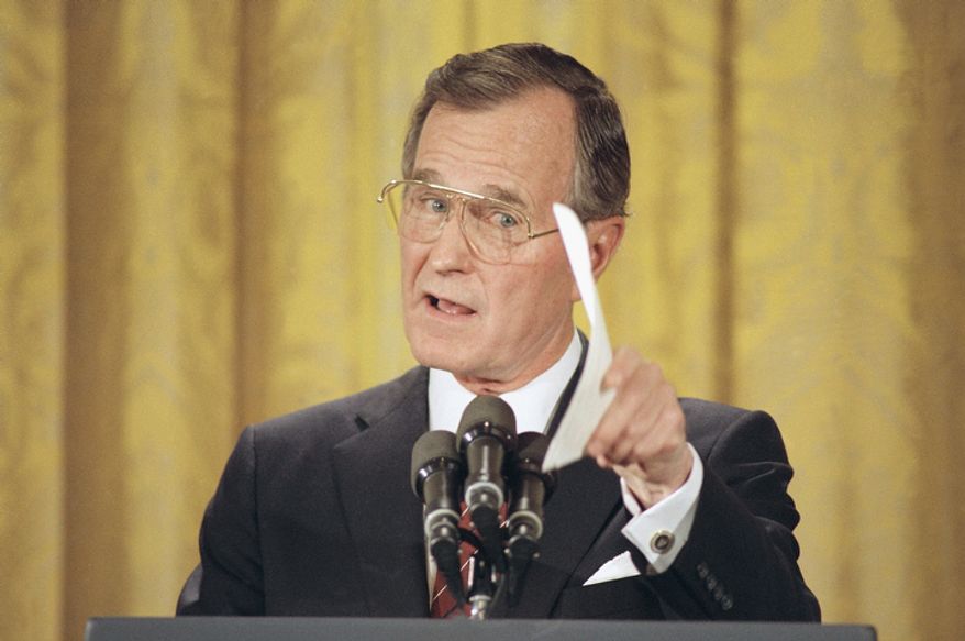 Pres. George H. W. Bush makes a point during first presidential prime time televised news conference in the East Room of the White House, Thursday, June 9, 1989, Washington, D.C. Bush told reporters that the United States cannot return to totally normal relations with china unless that government recognizes the validity of democracy forces. (AP Photo/Ron Edmonds)