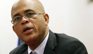 President Michel Martelly talks to reporters during a news conference, Monday, Dec, 10, 2012, in North Miami Beach, Fla. (AP Photo/Alan Diaz)

