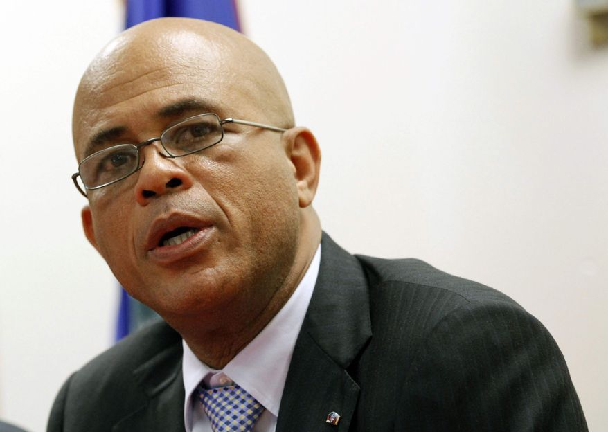 President Michel Martelly talks to reporters during a news conference, Monday, Dec, 10, 2012, in North Miami Beach, Fla. (AP Photo/Alan Diaz)