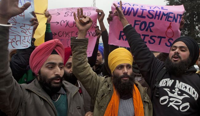 Kashmiri Sikh students protesting the gang rape of a woman on a bus last week in New Delhi shout slogans in Srinagar, India, on Thursday, Dec. 27, 2012. (AP Photo/Dar Yasin)
