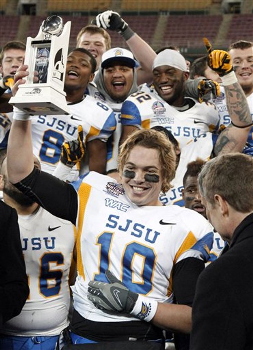 San Jose State quarterback David Fales (10) holds the most valuable player trophy after the Military Bowl college football game against Bowling Green at RFK Stadium Thursday, Dec. 27, 2012 in Washington. The Spartans won 29-20. (AP Photo/Alex Brandon)