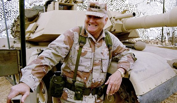 **FILE** Gen. H. Norman Schwarzkopf stands at ease with his tank troops during Operation Desert Storm in Saudi Arabia on Jan. 12, 1991. (Associated Press)