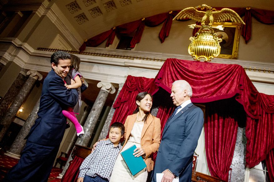Brian Emanuel Schatz (D-Hawaii) and his wife Linda greet their children Tyler, 9, third from left, and Mia, 4, second from left, after re-enacting Schatz's swearing in ceremony with Vice President Joe Biden inside the old Senate Chamber at the U.S. Capitol Building, Washington, D.C., Thursday, December 27, 2012. Schatz, who was the Lt. Gov. for Hawaii was selected by Hawaii Gov. Neil Abercrombie to the U.S. Senate seat left vacant by the late Daniel K. Inouye. (Andrew Harnik/The Washington Times)