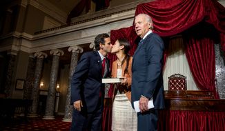 Brian Emanuel Schatz (D-Hawaii), kisses his wife, Linda, after re-enacting his swearing-in ceremony with Vice President Joe Biden inside the old Senate Chamber at the U.S. Capitol Building, Washington, D.C., Thursday, Dec. 27, 2012. Schatz, who was the Lieutenant Governor for Hawaii was selected by Hawaii Gov. Neil Abercrombie to the U.S. Senate seat left vacant by the late Daniel K. Inouye. (Andrew Harnik/The Washington Times)