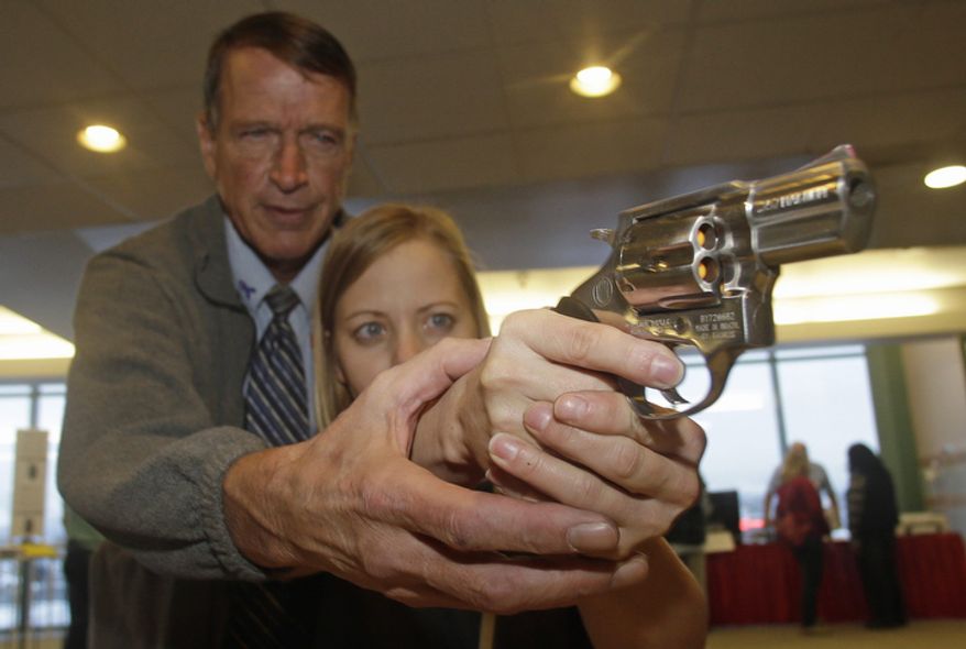 Cori Sorensen, a fourth-grade teacher at Highland Elementary School in Highland, Utah, receives firearms training Dec. 27, 2012, with a .357 magnum from personal defense instructor Jim McCarthy during concealed-weapons training for 200 Utah teachers in West Valley City, Utah. The Utah Shooting Sports Council offered six hours of training in handling concealed weapons in the latest effort to arm teachers to confront school assailants. (Associated Press)