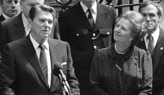 **FILE** Britain&#39;s Prime Minister Margaret Thatcher smiles with satisfaction as President Ronald Reagan makes a farewell speech June 9, 1982, outside her Downing Street office in London prior to his departure for Bonn. (Associated Press)
