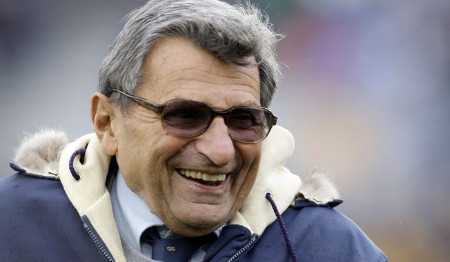 **FILE** Penn State coach Joe Paterno smiles as he walks the field before an NCAA college football game against Minnesota in State College, Pa., on Oct. 17, 2009. (Associated Press)