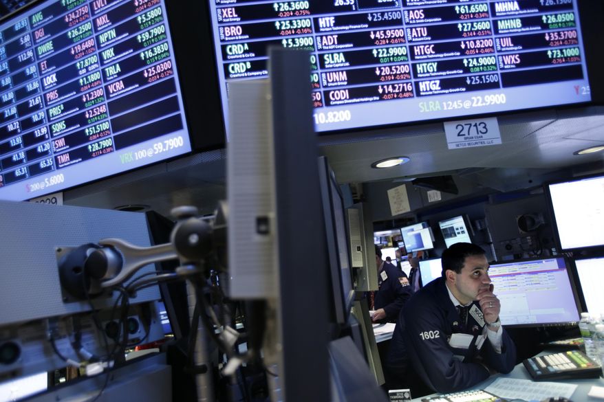 A trader works on the floor at the New York Stock Exchange in New York on Dec. 28, 2012. (Associated Press)