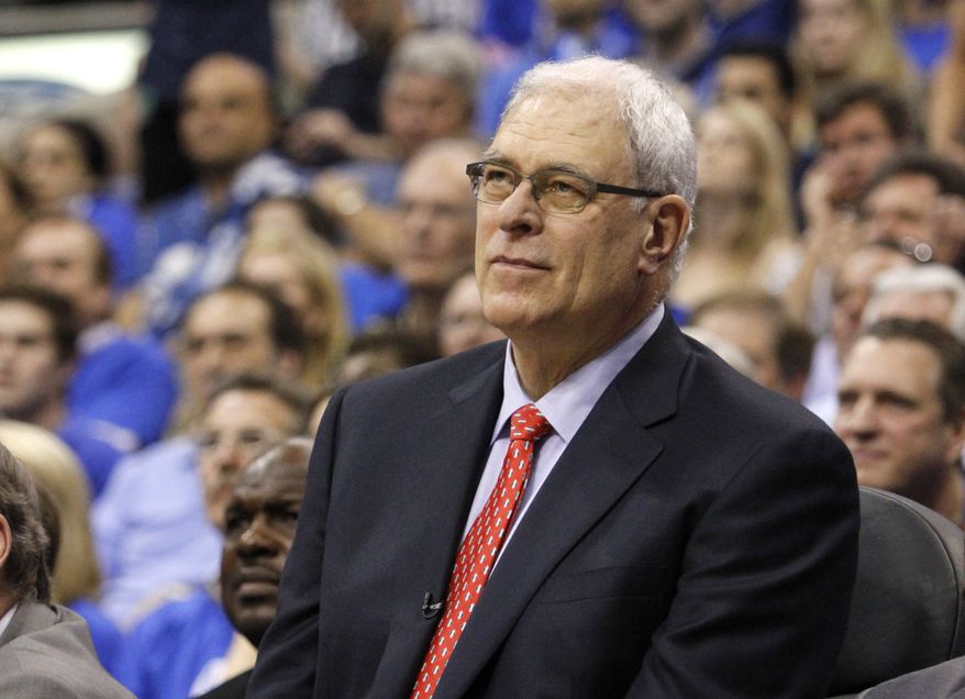 Phil Jackson could be atop Nets owner Mikhail Prokhorov's coaching list after Avery Johnson was fired with the team 14-14. (Associated Press)