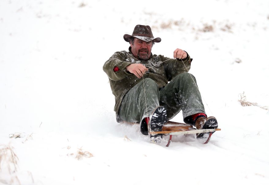 Matt Nigro sleds down a hill in Lode Star Park in Fredon, N.J., on Saturday, Dec. 29, 2012. Snow from the second winter storm in less than a week fell over most of the Northeast and the upper Ohio River Valley. (AP Photo/The New Jersey Herald, Amy Herzog)