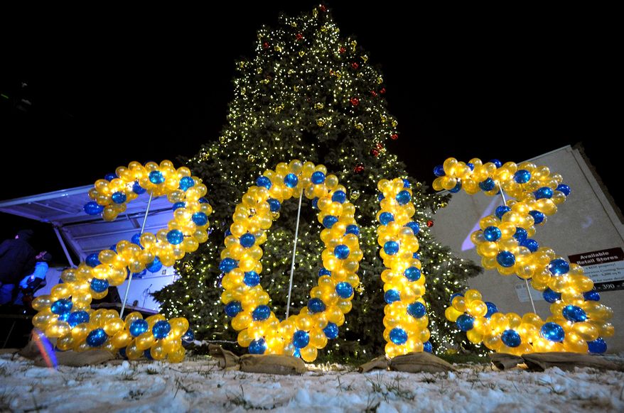 Balloons spell out the number 2013 at an outdoor festival to celebrate the end of Allentown's 250th year Monday, Dec. 31, 2012, in Allentown, Pa. (AP Photo/The Express-Times, Matt Smith)
