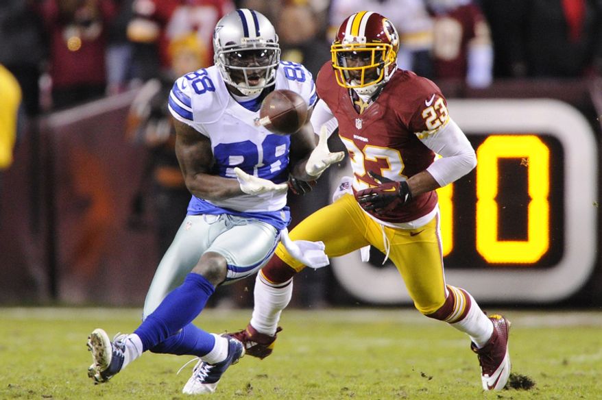 Dallas Cowboys wide receiver Dez Bryant (88) hauls in a first down reception in front of Washington Redskins cornerback DeAngelo Hall (23) during second-quarter action at FedEx Field, Landover, Md., Dec. 30, 2012. (Preston Keres/Special to The Washington Times)