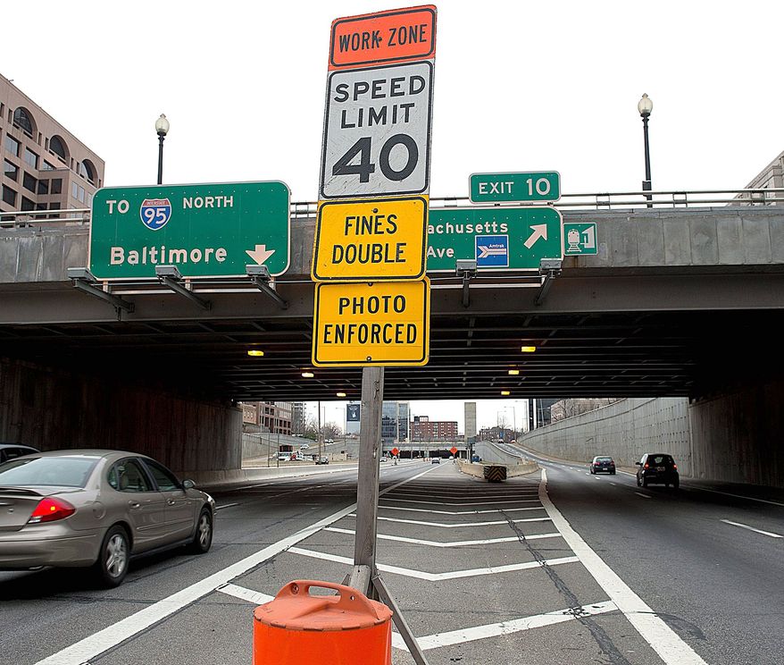 The speed limit at the Third Street Tunnel, normally 45 mph, was marked 40 mph for a work zone. Although the work zone seems to be gone, the speed limits have not been readjusted. A police officer who was nabbed by one of the cameras is demanding a second look at thousands of tickets issued. (Barbara L. Salisbury/The Washington Times)