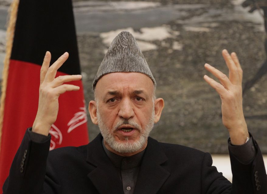 Afghan President Hamid Karzai gestures during a press conference at the presidential palace in Kabul, Afghanistan, on Saturday, Dec. 8, 2012. (AP Photo/Ahmad Jamshid)