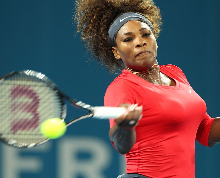 Serena Williams of the U.S. plays a shot in her match against Alize Cornet of France during the Brisbane International tennis tournament in Brisbane, Australia, Tuesday, Jan 1, 2013. (AP Photo/Tertius Pickard)