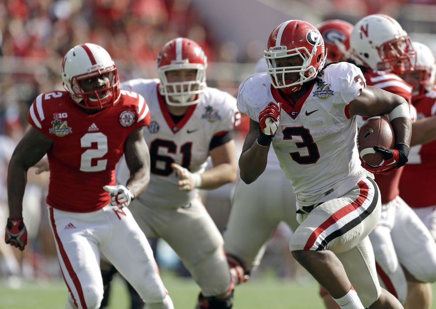 Georgia running back Todd Gurley (3) runs for a 24-yard touchdown past the Nebraska defense during the first half of the Capital One Bowl NCAA football game, Tuesday, Jan. 1, 2013, in Orlando, Fla. (AP Photo/John Raoux)
