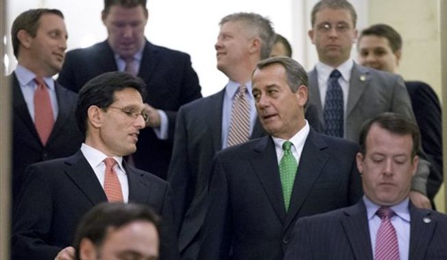 House Speaker John A. Boehner (center right), Ohio Republican, and House Majority Leader Eric Cantor (center left), Virginia Republican, walk to a second GOP caucus meeting to discuss the &quot;fiscal cliff&quot; bill — which was passed by the Senate on Monday night — at the U.S. Capitol in Washington on Tuesday, Jan. 1, 2013. (AP Photo/J. Scott Applewhite)