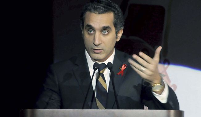 Egyptian TV host Bassem Youssef addresses attendees at a gala dinner party in Cairo on Saturday, Dec. 8, 2012. Egyptian prosecutors on Tuesday launched an investigation against Mr. Youssef, a popular television satirist, for allegedly insulting the president in the latest case raised by Islamist lawyers against outspoken media personalities. (AP Photo/Ahmed Omar)