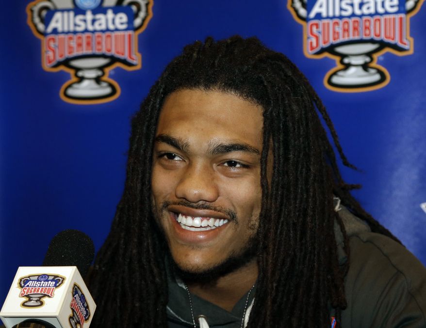 Florida defensive back Josh Evans is all smiles as he answers questions at a news conference in New Orleans, Saturday, Dec. 29, 2012. Florida will face Louisville in the Sugar Bowl NCAA college football game on Jan. 2, 2013. (AP Photo/Bill Haber)