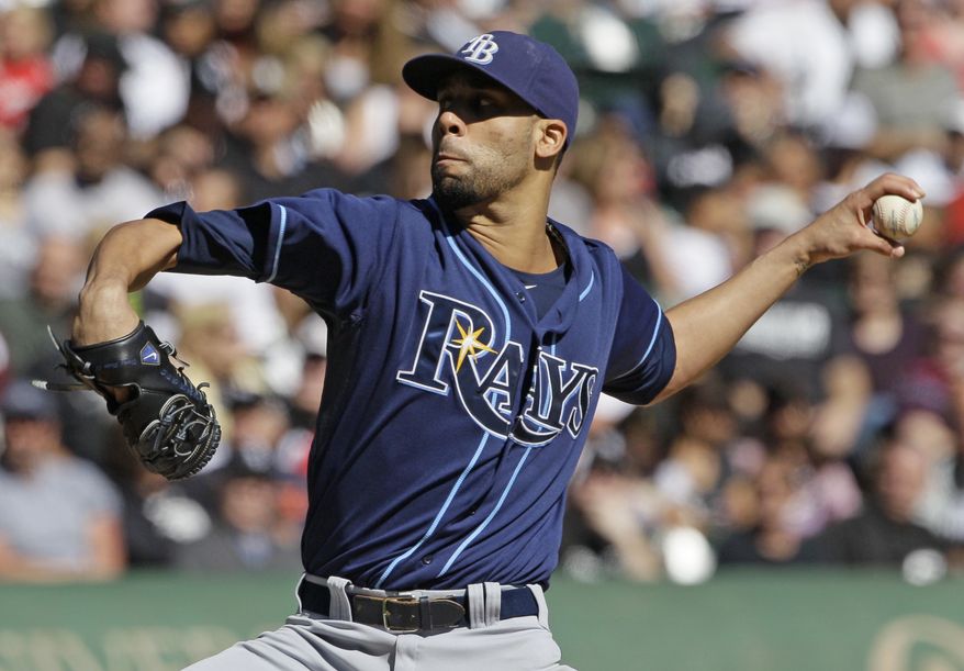 FILE - Tampa Bay Rays starter David Price throws against the Chicago White Sox during the first inning of a baseball game in Chicago, in this Sept. 30, 2012 file photo. The three-time All-Star and the Tampa Bay Rays have agreed to a one-year contract worth just over $10 million, avoiding arbitration a person with knowledge of the deal said Tuesday night Jan. 1, 2013. (AP Photo/Nam Y. Huh, File)