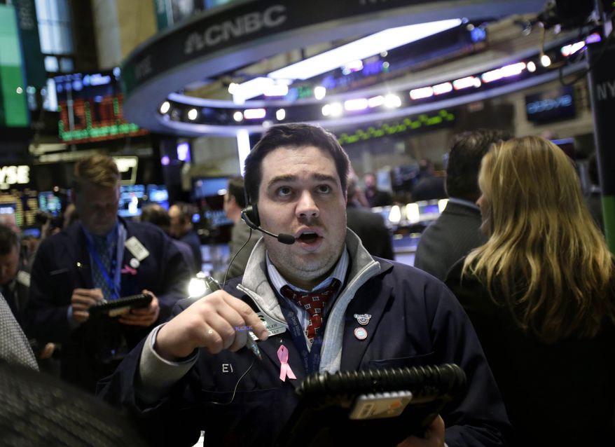 A trader works on the floor at the New York Stock Exchange in New York on Jan. 2, 2013. (Associated Press)