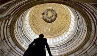 A statue of President George Washington is seen in the foreground at the Rotunda of the U.S. Capitol. (AP Photo/J. Scott Applewhite) ** FILE **