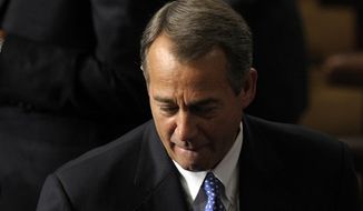 House Speaker John A. Boehner of Ohio walks in House of Representatives chamber on Capitol Hill in Washington, Thursday, Jan. 3, 2013, as the 113th Congress began. (AP Photo/Susan Walsh)