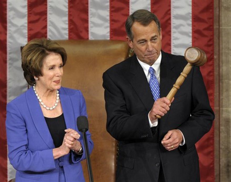 House Minority Leader Nancy Pelosi, California Democrat, applauds after handing the gavel to House Speaker John A. Boehner, Ohio Republican, who was re-elected as House Speaker of the 113th Congress, on Jan. 3, 2013, on Capitol Hill in Washington. (Associated Press)
