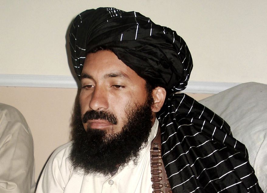 ** FILE ** In this April, 20, 2007 file photo, Pakistani militant commander Maulvi Nazir meets his associates in South Waziristan, Pakistan, near the Afghani border. Five Pakistani security officials said the commander, Nazir, was reportedly among nine people killed in a missile strike on a house in the village of Angoor Adda in the South Waziristan tribal region early Thursday. (AP Photo/Ishtiaq Mahsud)