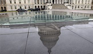 In this Tuesday, Jan. 1, 2013, file photo, the dome of the Capitol is reflected in a skylight of the Capitol Visitor&#39;s Center in Washington. (AP Photo/Jacquelyn Martin, File)