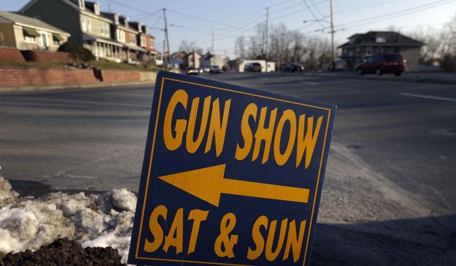 ** FILE ** A sign is posted for an upcoming gun show, Friday, Jan. 4, 2013, in Leesport, Pa. (AP Photo/Matt Rourke)

